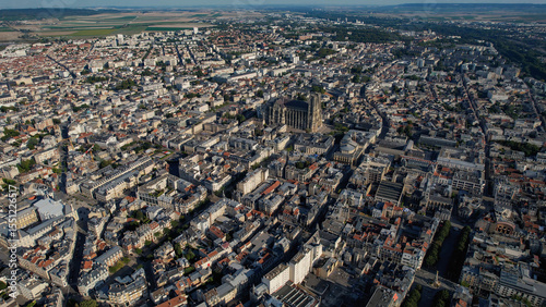 Fototapeta Naklejka Na Ścianę i Meble -  An Aerial panorama view with pan of the old town around the city Reims in France on a sunny spring noon