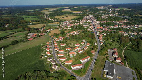 Fototapeta Naklejka Na Ścianę i Meble -  An Aerial panorama view with pan of the old town around the city Sainte-Menehould in France on a sunny spring noon