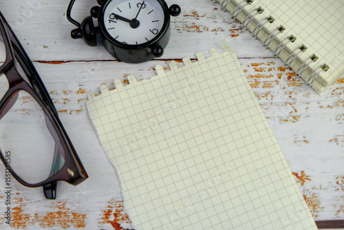 flatlay of a workplace with a notebook, on a plain background. Education, business and office concept. 