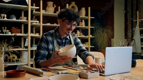 Obraz na plátně Male potter artist Caucasian guy man small business owner salesman seller design