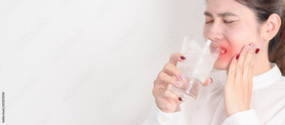 Business woman having toothache and pain after drink ice water for concept of Teeth Sensitive to Cold, Tooth Decay and Gum Disease, Grinding Teeth and Stress, Exposed Nerve Roots, Crack and Receding Business woman having toothache and pain after drink ice water for concept of Teeth Sensitive to Cold, Tooth Decay and Gum Disease, Grinding Teeth and Stress, Exposed Nerve Roots, Crack and Receding