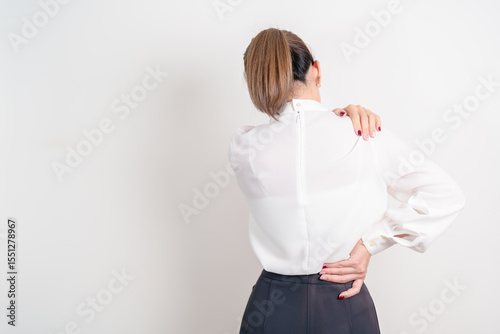 Business woman having back body ache for concepts of Back Muscle Strain, Piriformis Syndrome, Low Back Pain, Lumbar Disc Degeneration, Herniated, Osteoporosis, Spinal Compression and Office syndrome