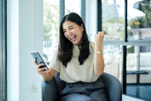 Video call. Young Asian woman communicating on long-distance online video. looking digital smartphone screen Happy talking with friends happily