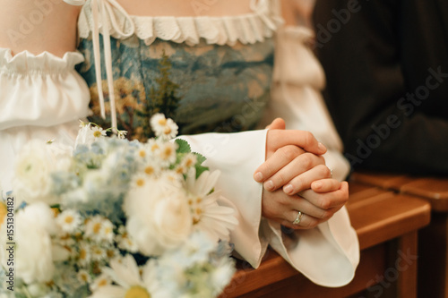 The bride's hands before the altar