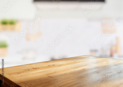 Wooden counter mockup with bokeh interior, ideal for product display.
