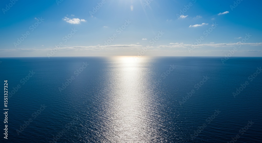 Fototapeta premium Sun-Kissed Horizon: Sparkling Reflection Over a Vast Open Ocean During Daylight