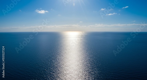 Wallpaper Mural Sun-Kissed Horizon: Sparkling Reflection Over a Vast Open Ocean During Daylight Torontodigital.ca