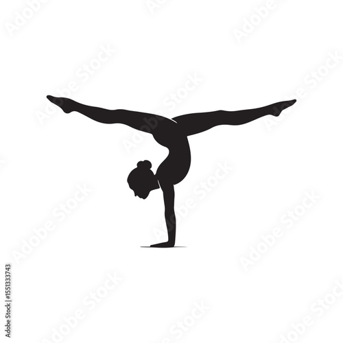 Silhouette of a female gymnast performing a handstand with legs split wide
