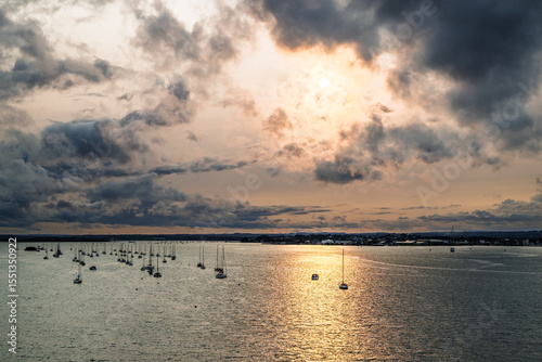 Sunset of Yachts over Ramshorn Lake and Brownsea, Poole, Dorset, England photo