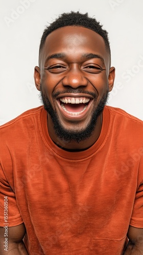 Portrait of an black man with a wide, happy smile and open arms, showing the energetic and outgoing sanguine temperament.