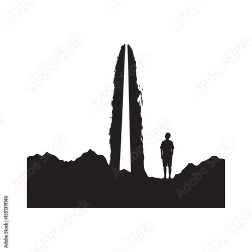 Person gazing up at waterfall silhouette
