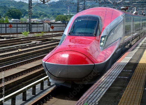 Modern high speed shinkansen train at platform in Japan
