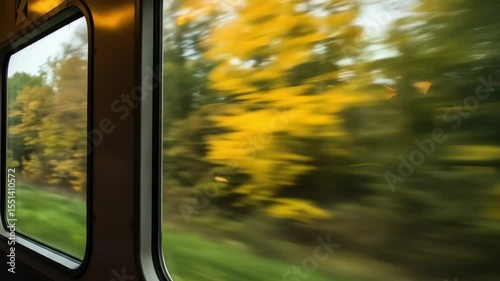 Autumn scenery viewed from train window with blurred motion  