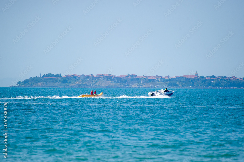 Obraz premium banana boating in the sea in Bulgaria with Nesebar on background