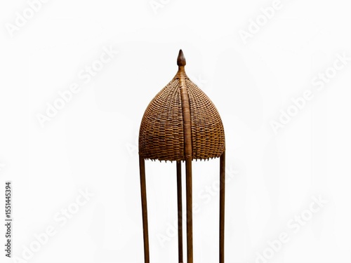 The white background in the picture is a beautifully woven brown rattan frame with detailed patterns. It is a beautiful and natural lamp that can be used as a decorative lamp in homes or restaurants