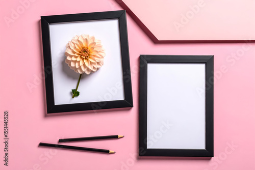Frame mockup with flower and pencils on pink background flat lay
