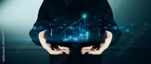 hand of businessman interactive touching a holographic of transaction financial network data system, concept of technology artificial intelligence with human user application