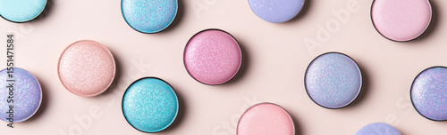 Eyeshadow palette flat lay showcasing diverse textures and colors in circular pans