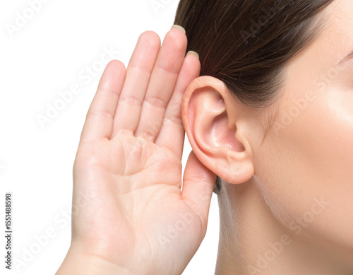 A close-up image of a woman holding her hand behind her ear, as if trying to listen carefully.