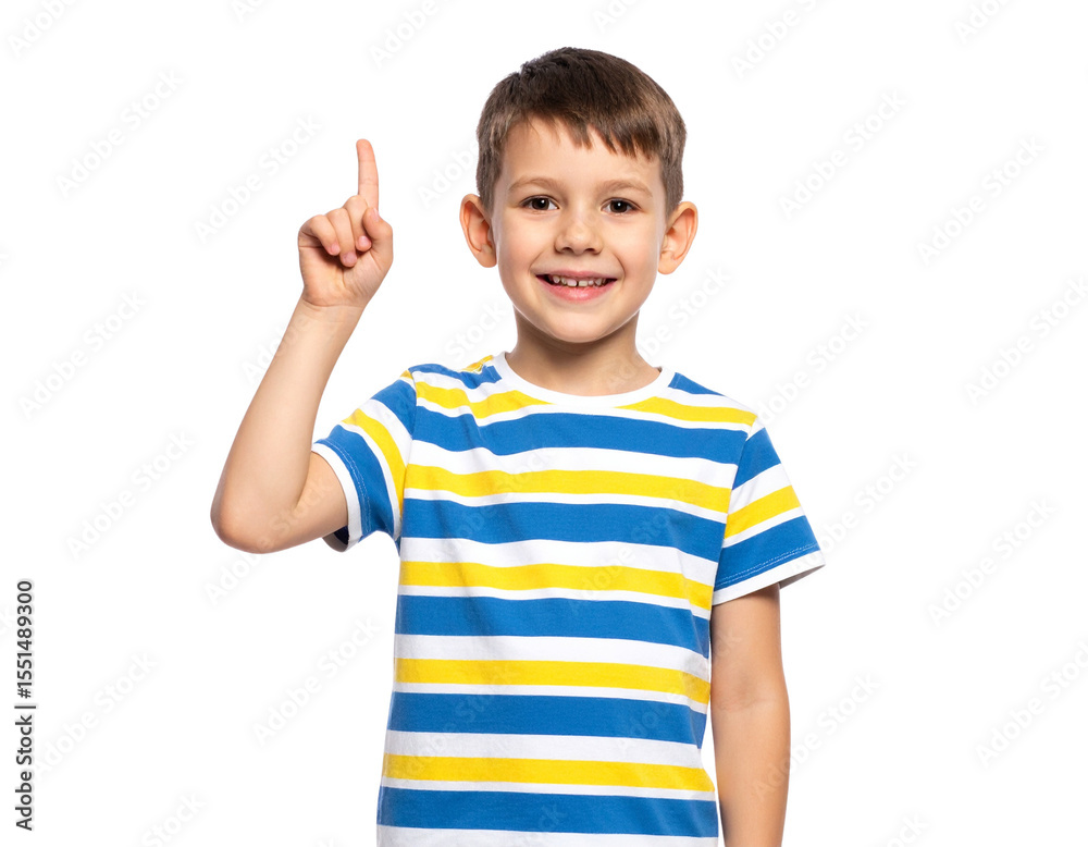 A smiling young boy wearing a colorful striped t-shirt raises his index finger with enthusiasm and confidence. A smiling young boy wearing a colorful striped t-shirt raises his index finger with enthusiasm and confidence.