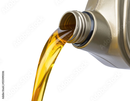 Golden motor oil is being poured from a silver container, showing a smooth, flowing liquid stream.