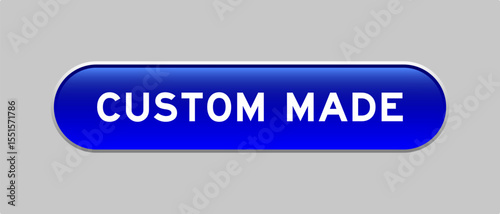 Blue color capsule shape button with word custom made on gray background