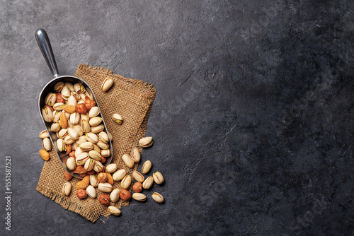 A vibrant assortment of various nuts, including almonds, walnuts, hazelnuts, cashews, and pistachios