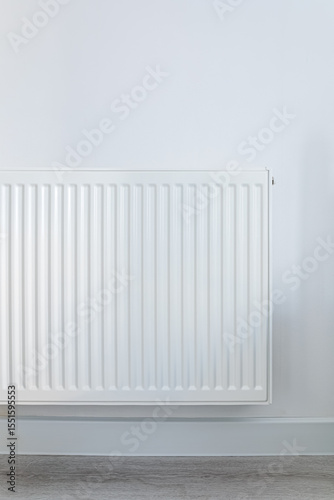 Wallpaper Mural  White metal radiator mounted on a clean white wall with light grey flooring, minimalistic home heating concept with natural lighting and soft shadows Torontodigital.ca