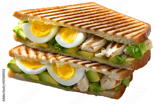 Grilled panini sandwich with hard boiled eggs avocado lettuce and chicken on toasted bread with grill marks isolated on transparent background. Png.