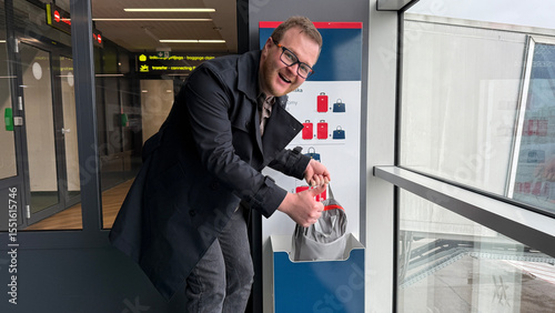 Smiling man of undetermined ethnicity enjoys quirkiest airport carousel shuffle, embodying Global Take a Walk in the Park Day