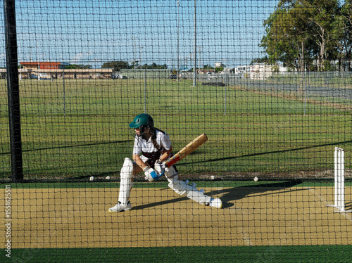 Cricket training and practice in the nets for left handed female cricket player
