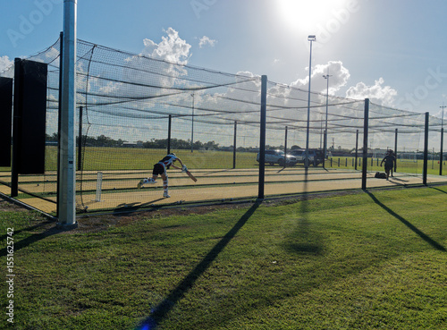 Cricket training and practice in the nets for left handed female cricket player