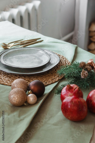 Serving a festive Christmas table in Scandinavian style. Decor on the table before the holiday.