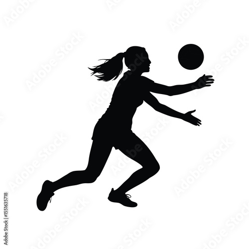 Silhouette of a female volleyball player diving for the ball in action