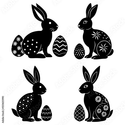 Four easter rabbits with decorated eggs isolated on white background