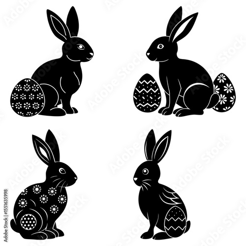 Four easter rabbits with decorated eggs isolated on white background
