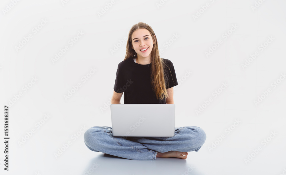 Naklejka premium Portrait of teenage girl in casual black t-shirt on light background in studio.
