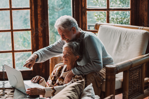 Senior couple in their 70s spending calm and quality time together in a cozy mountain chalet. A serene and intimate atmosphere of connection, wellness, and joy in quiet, mindful shared moments