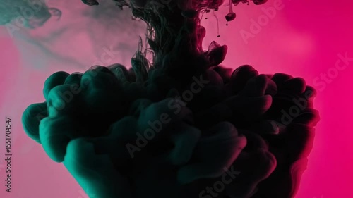 Abstract ink swirl creating vibrant colors in a fluid backdrop