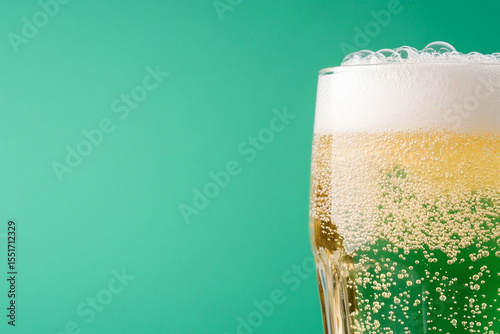 Bubbles rise in a glass of sparkling water creating a lively effect