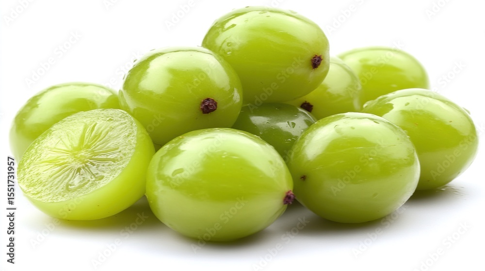 Fresh, vibrant green grapes, some halved, displaying juicy interior Fresh, vibrant green grapes, some halved, displaying juicy interior