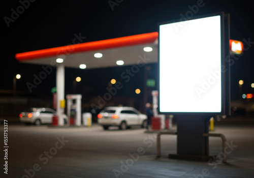 Blank digital billboard at night gas station