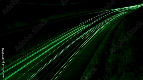 green car lights at night. long exposure