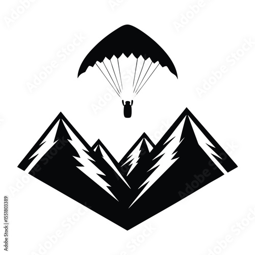 Paraglider flying above mountains in black and white graphic silhouette