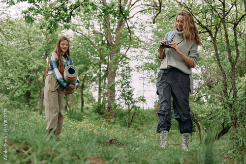 Active middle age woman enjoying nature in spring forest, promoting health, fitness, wellbeing, and wellness for a balanced and healthy lifestyle.