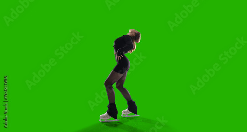 Figure skater woman on green screen.