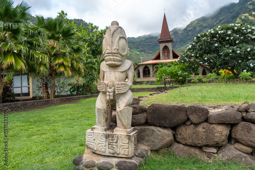 Tiki statue in front of the Vaitahu church, Tahuata, Marquesas Islands, French Polynesia