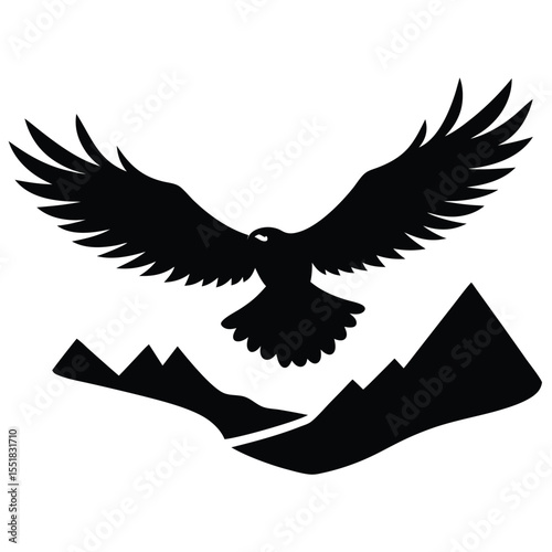 Black silhouette of an eagle flying above mountain peaks view