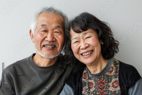 Portrait of a happy asian couple in their 60s expressing their feelings