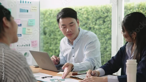 Young people asia man talk advice ESG work eco go green net zero waste SDGs growth hope clean energy control carbon credit offset recycle report. The way forward asian company workshop project office.